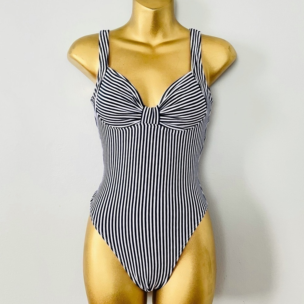 Sunsations vertical striped swimsuit euro summer 2025 coastal chic